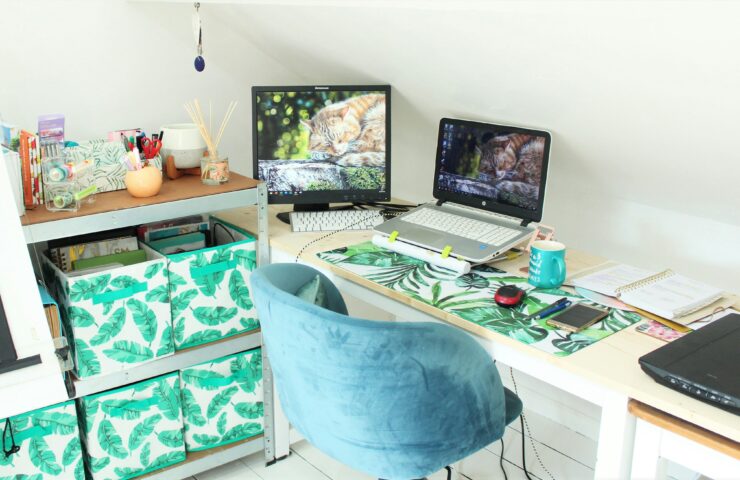 black laptop computer on white table